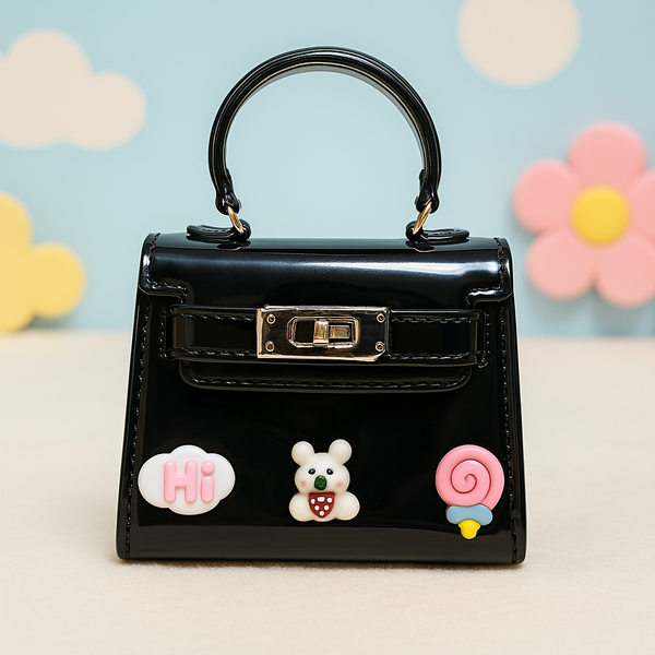 Glossy Black Mini Purse for Kids – Stylish Trapezoid Bag with Cute Bear, Cloud & Lollipop Charms.